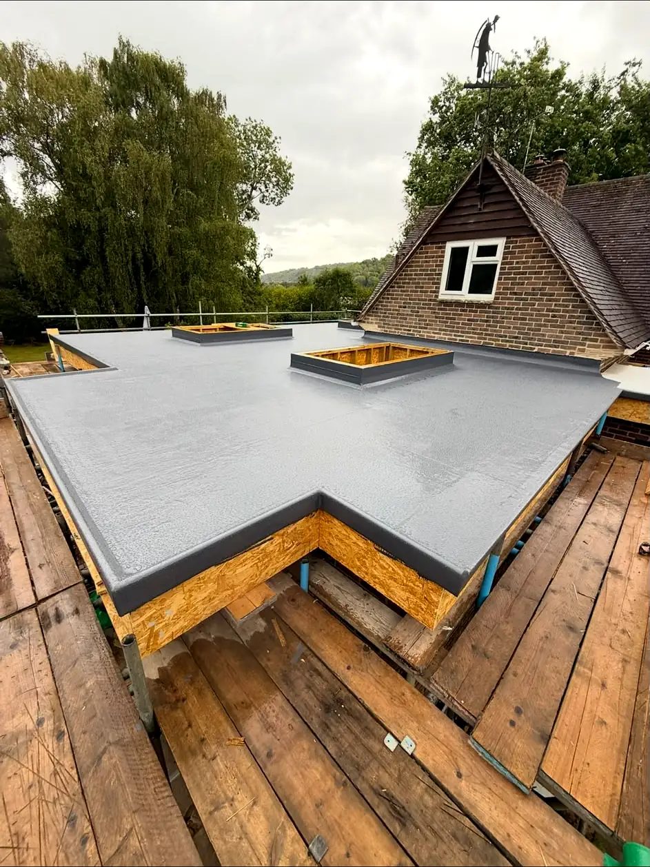 GRP fibreglass flat roof with rooflight kerbs on a rear extension
